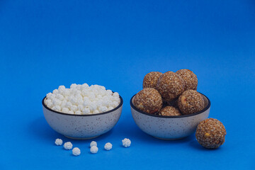 Happy Makar Sankranti, Pongal and Uttarayan with Kite, haldi kum kum bowls and tilgul sweets