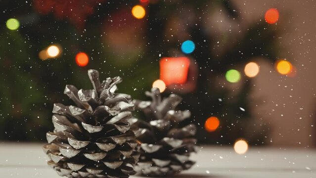 Animation of snow falling over christmas cones