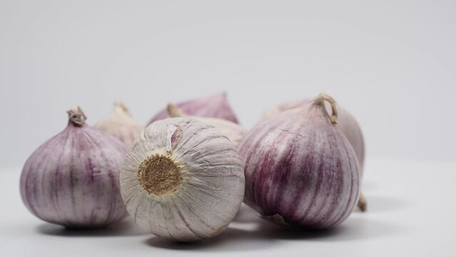 Rotating garlic on a white background.