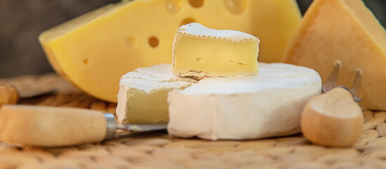 Cheese is on the table. Selective focus.