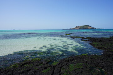 clear shoaling beach and island