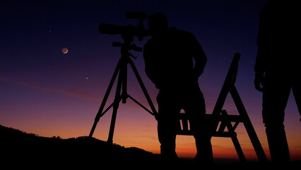 Men with astronomy telescope looking at the night sky, stars, planets, Moon and shooting stars.