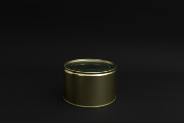Canned food in a tin on a black background