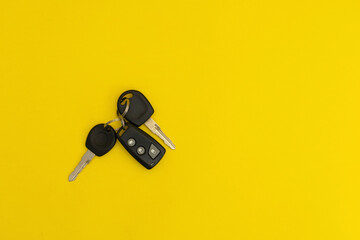 Car keys on yellow background