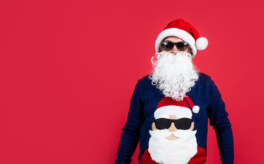happy bearded man in santa claus costume celebrate winter holiday of chistmas and feel merry about xmas gifts, party fun, copy space