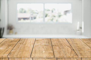 blur white interior room windows with wooden table space for products montage advertising background