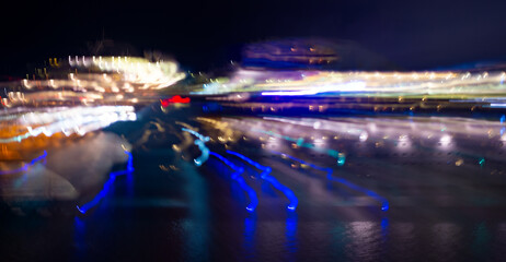 blurred dark shade background of night street. blurred motion backdrop. blurred motion long exposure