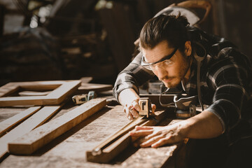 carpenter man furniture artisan handcrafted making woodwork at wood workshop - obrazy, fototapety, plakaty