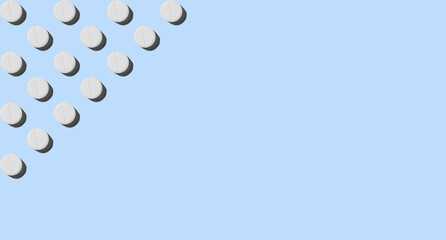 White pills on a blue background. Pattern for the background. Medical pharmacy bright design for presentation packaging, website flyer ,cover, business cards. Banner, copyspace