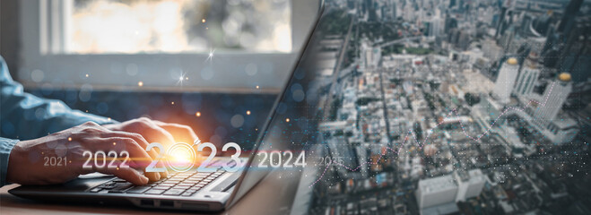 Trend of 2023. people business investor using laptop with virtual 2023 year diagram, business trend, change from 2022 to 2023, strategy, investment, business planning and happy new year concept