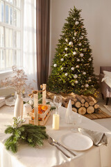 Beautiful table setting with Christmas decorations in living room. Dinner or lunch