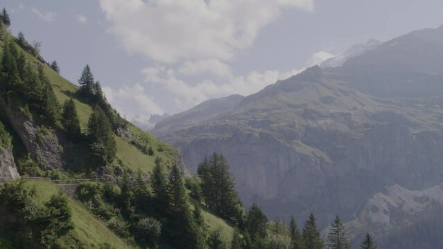 Driving video of the Sustenpass in Switzerland. The Susten pass is a famous alp road and has a scenic mountain panorama. View from the car. Experience calming nature and exciting pass roads.