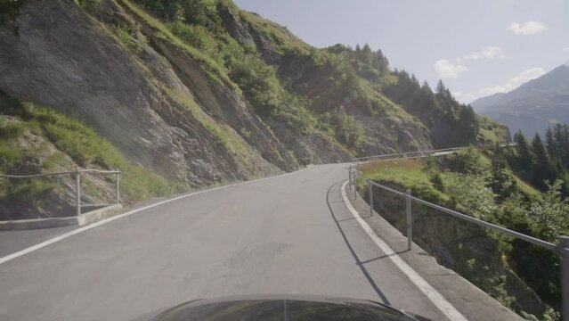 Driving video of the Sustenpass in Switzerland. The Susten pass is a famous alp road and has a scenic mountain panorama. View from the car. Experience calming nature and exciting pass roads.