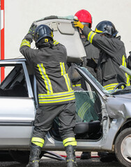 fire brigade team in action during the rescue of the injured person after the accident