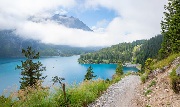 beautiful hiking trail lake Oeschinensee with stunning views, landscape Bernese Alps