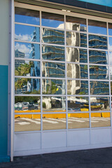 reflection in glass panes of roll-up garage door