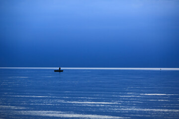 The fishman in the Rigas bay , Saulkrasti beach in Latvia