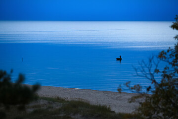 The fishman in the Rigas bay , Saulkrasti beach in Latvia