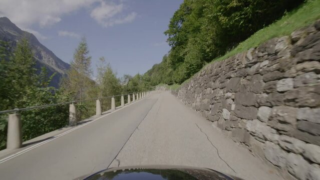 Driving video of the Sustenpass in Switzerland. The Susten pass is a famous alp road and has a scenic mountain panorama. View from the car. Experience calming nature and exciting pass roads.