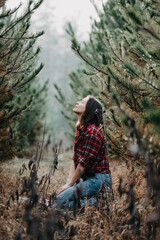 Naklejka premium Woman enjoy the pine wood forest - fashion photography