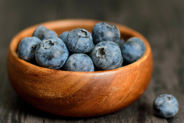 blueberry fruit in wooden bamboo bowl