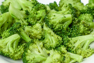 boiled broccoli in a white plate