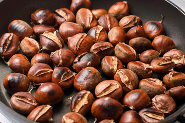 hot cooked chestnuts on pan