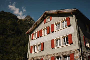Fototapeta na wymiar Common traditional building in Swiss Alps with picturesque facade.