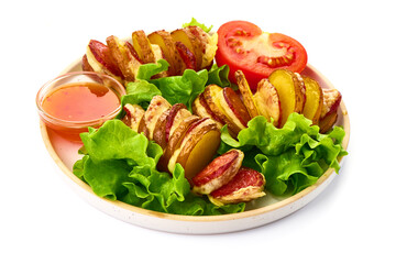 Baked potato wedges with cheese and sausages, herbs and vegetables