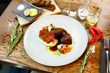 Deer tenderloin. Truffle-potato puree, porcini mushrooms, baked leek and carrot, juniper bread, port wine sauce. Delicious healthy traditional food served for lunch in modern gourmet restaurant