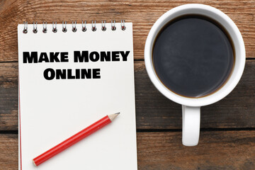 MAKE MONEY ONLINE lettering written on notepad. Business concept.