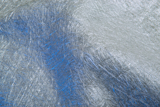 Fiber glass or fiberglass filaments foil, abstract texture background. High resolution photography. Raw material