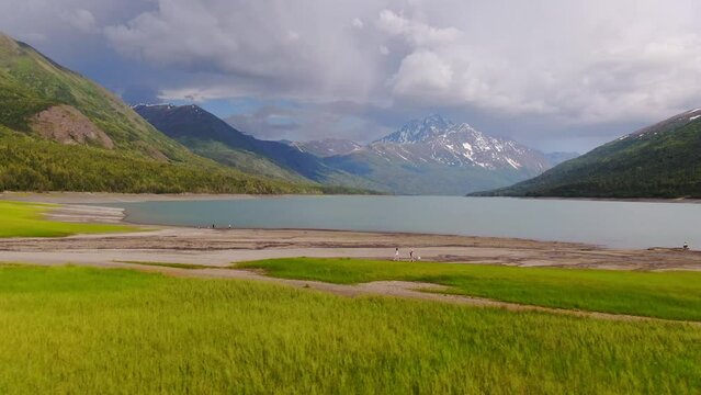 Alaska Lakeside Landscape On Cloudy Summer Day, Beautiful Panoramic Aerial View of Wild Nature, Valley Lake With Mountains Around - Sideways Tracking