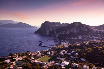 Fototapeta na wymiar Touristic Town on Capri Island in Bay of Naples, Italy. Sunrise Sky Art Render. Nature Background.
