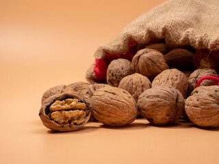 Walnut on an orange background. Raw walnut.