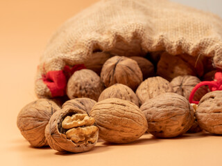 Walnut on an orange background. Raw walnut.