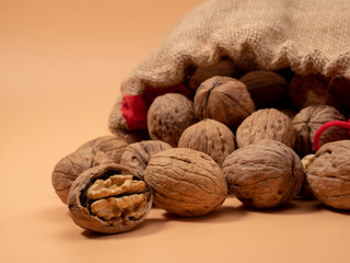 Walnut on an orange background. Raw walnut.