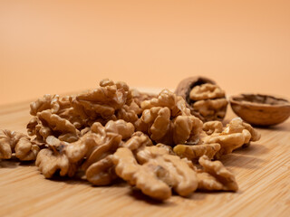 Walnut on an orange background. Raw walnut.