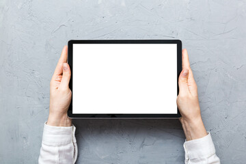 female teen hands using tablet pc with white screen, Mockup image of woman hand holding white tablet pc with blank white screen at home
