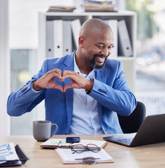 Business, hands in heart and black man in office with laptop, notebook and coffee at corporate...
