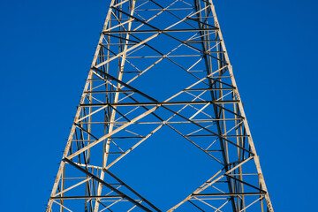 electric light pylon, steel structure for the infrastructure for the transport of electric cables with a grid of services and plants. symbol for industry and development.