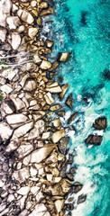 Overhead aerial view of Seychelles Beach with rocks, ocean landscape