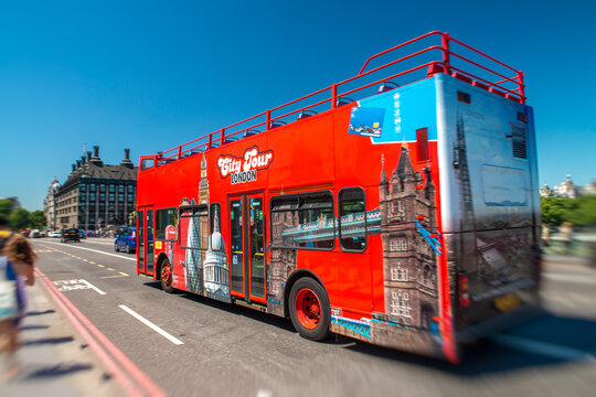 Red Sightseeing Tour Bus Across London. Tourism Concept