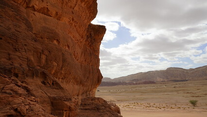 Fototapeta na wymiar Rock and red terrain, in the national geological Timna park, Israel