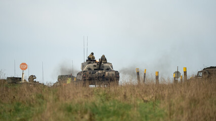 commander and gunner directing action on a British army FV4034 Challenger 2 ii main battle tank at...