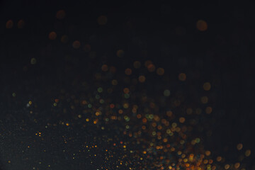 Abstract background of blurred colourful glitter for design. Lights bokeh dis focus. Christmas background, copy space