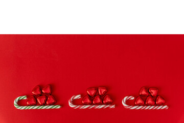 Christmas background with a sled, candy and a caramel cane