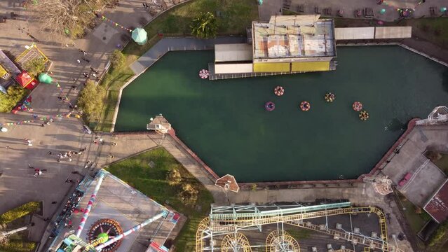 Aerial top down shot of Roller coaster and inflatable boats in amusement park in Buenos Aires