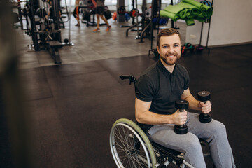 Person who uses a wheelchair training in the gym. Rehabilitation center