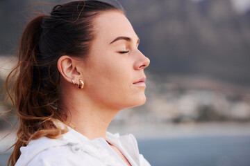 Woman, face and meditation outdoor, calm and spiritual freedom at beach, prayer and breathe in...